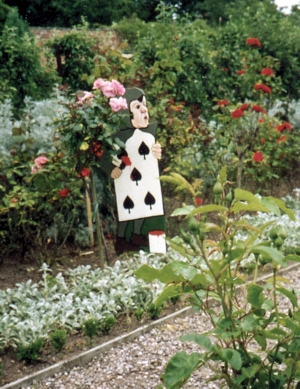 A playing card from Alice in Wonderland painting a white rose red